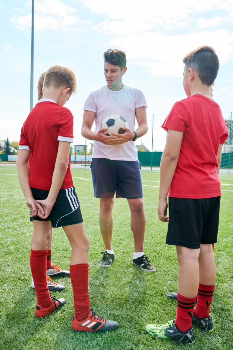 Coach Talking to Junior Football Team