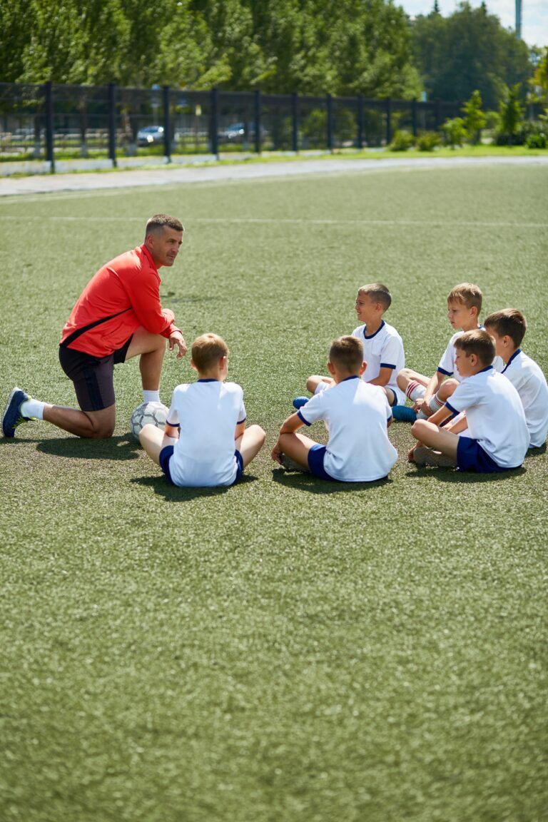 Coach Talking to Junior Football Team